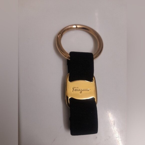 Salvatore Ferragamo Accessories - Ferragamo Vera Bow Black and Gold Bag Charm Keychain